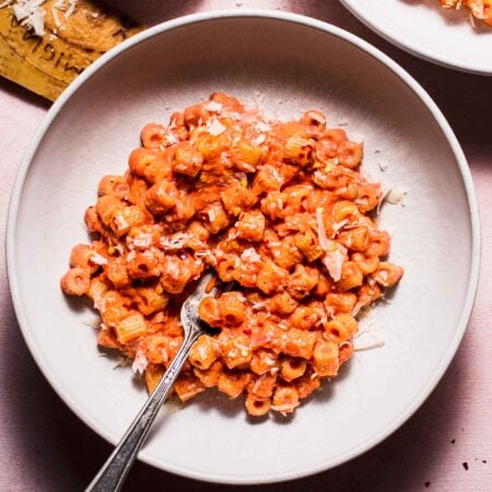 Bowl of rose sauce pasta with fork.