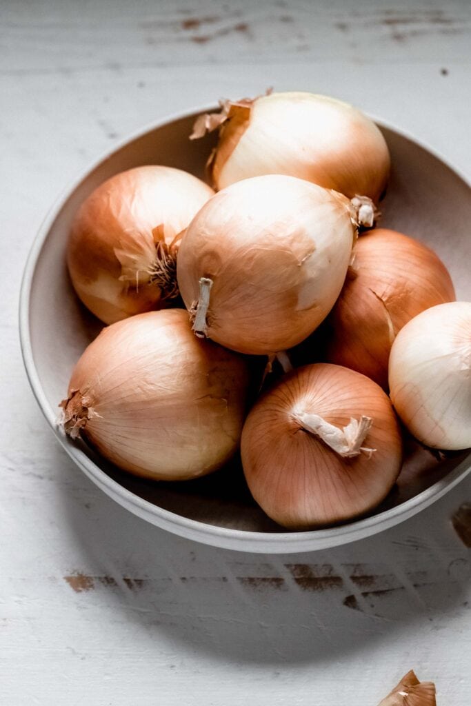 Whole onions in large bowl. 