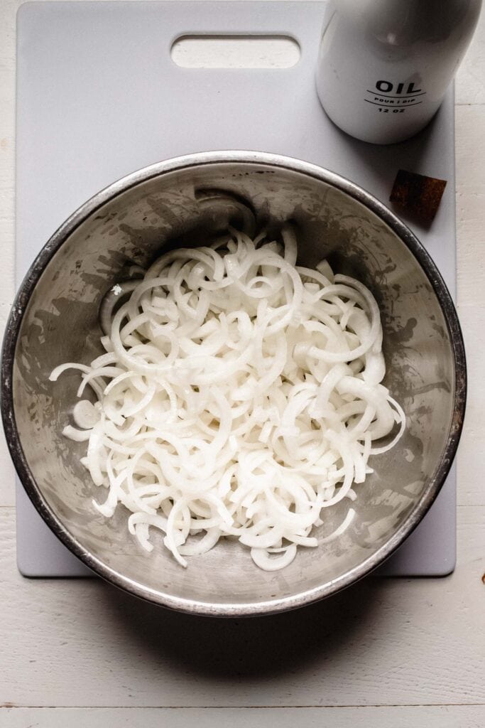 Sliced onions in bowl. 