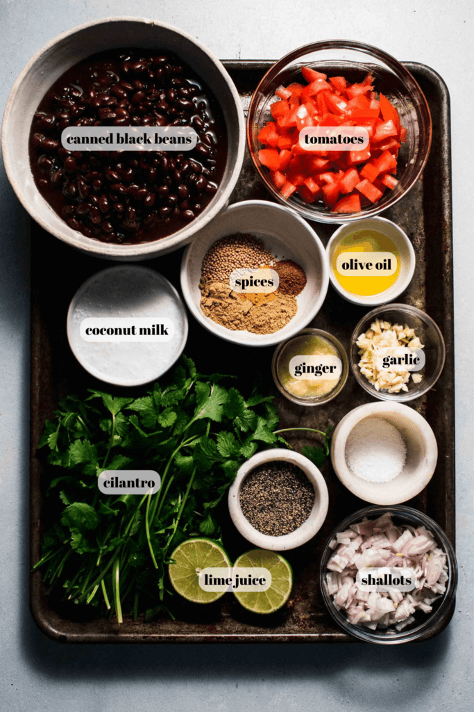 Ingredients for black bean curry labeled on tray.
