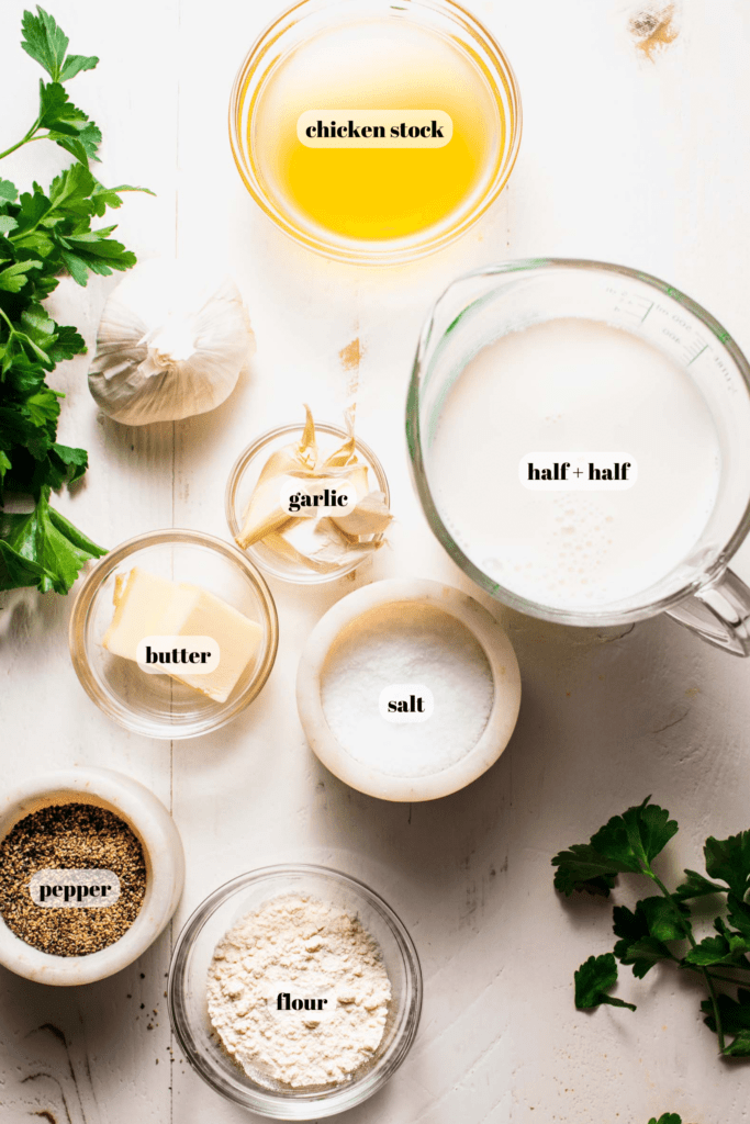 Ingredients for garlic cream sauce labeled on counter. 