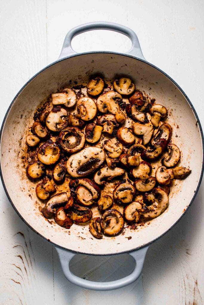 Sauteed mushrooms in skillet. 