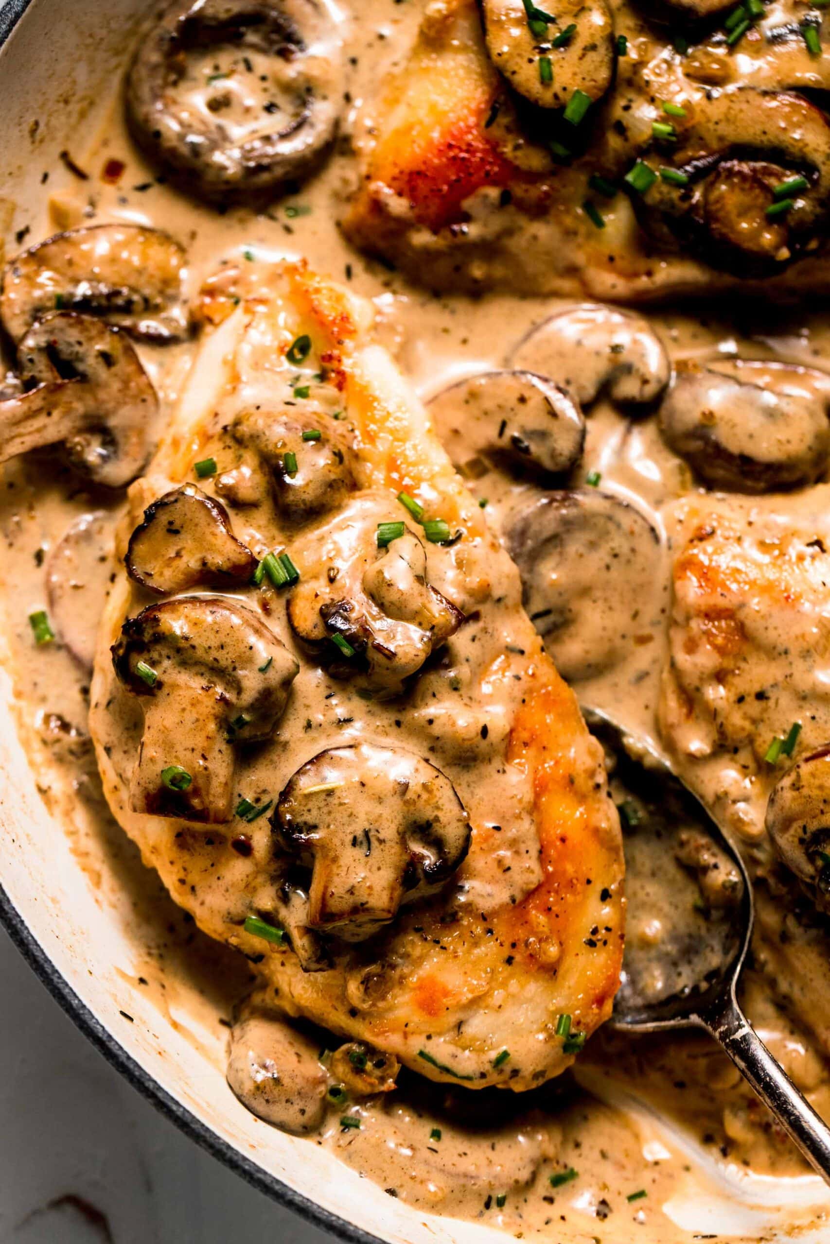 Chicken breasts coated in mushroom sauce. 