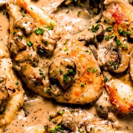 Chicken breasts nestled in mushroom sauce.