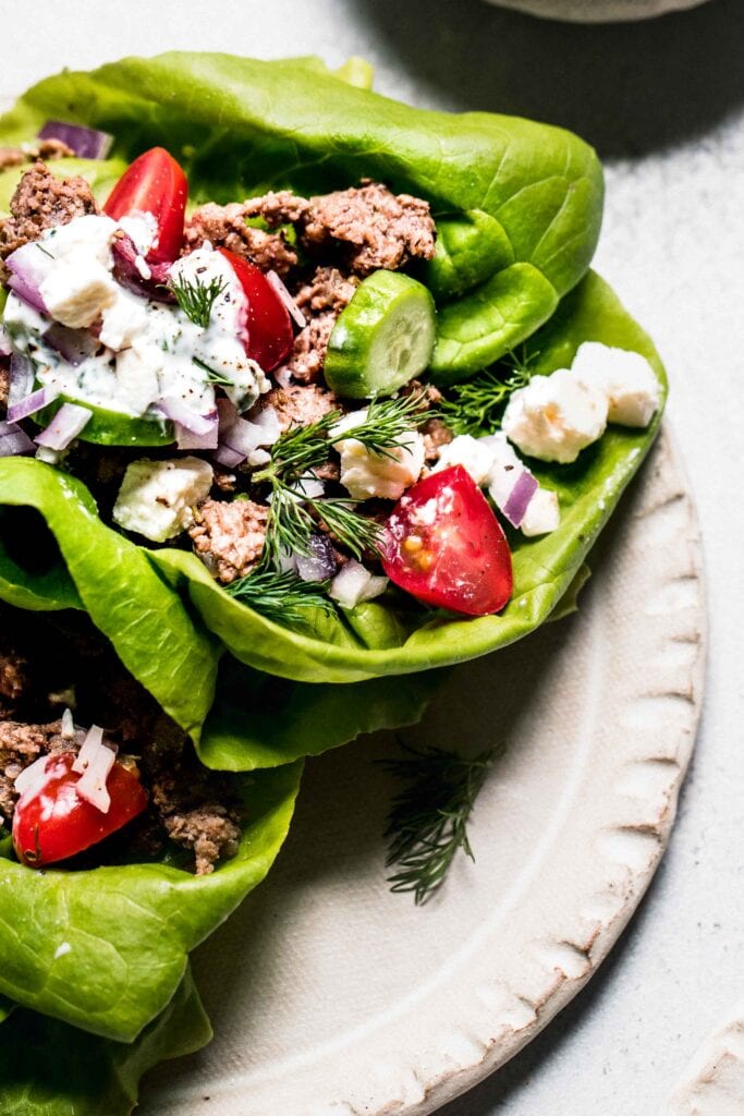 Close up of prepared lamb lettuce cup with toppings. 