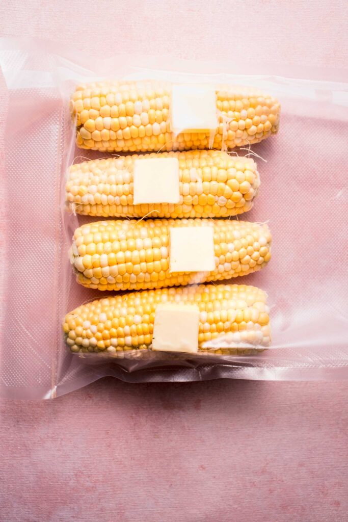 Corn and butter pats in bag. 