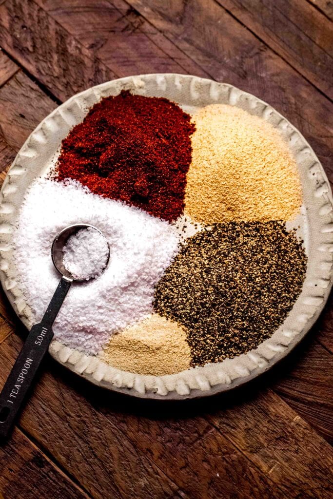 Ingredients for dry rub on plate before mixing. 