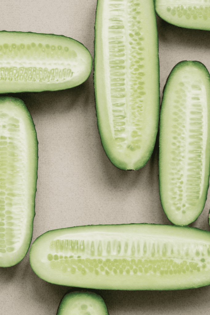 White wonder cucumbers on white backdrop.