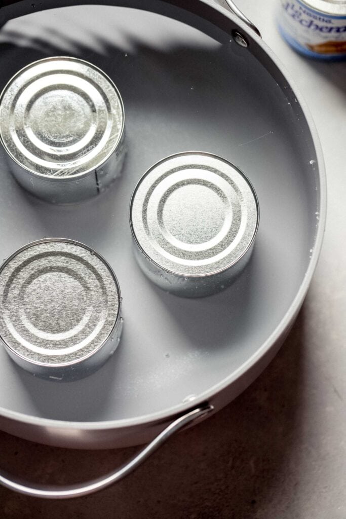 Cans in water. 