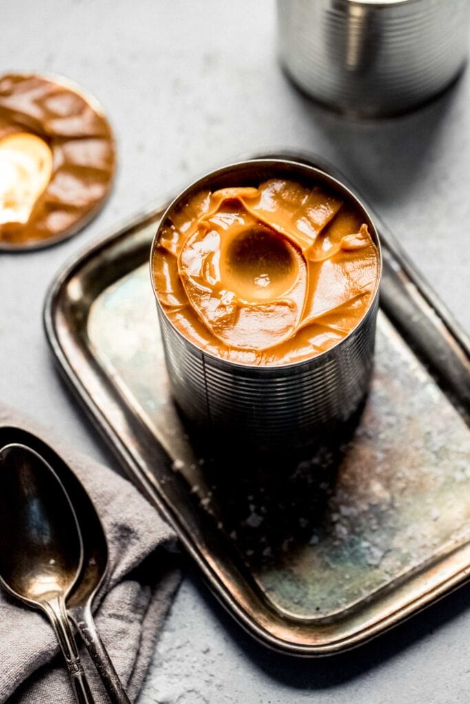 Can of dulce de leche with lid removed. 
