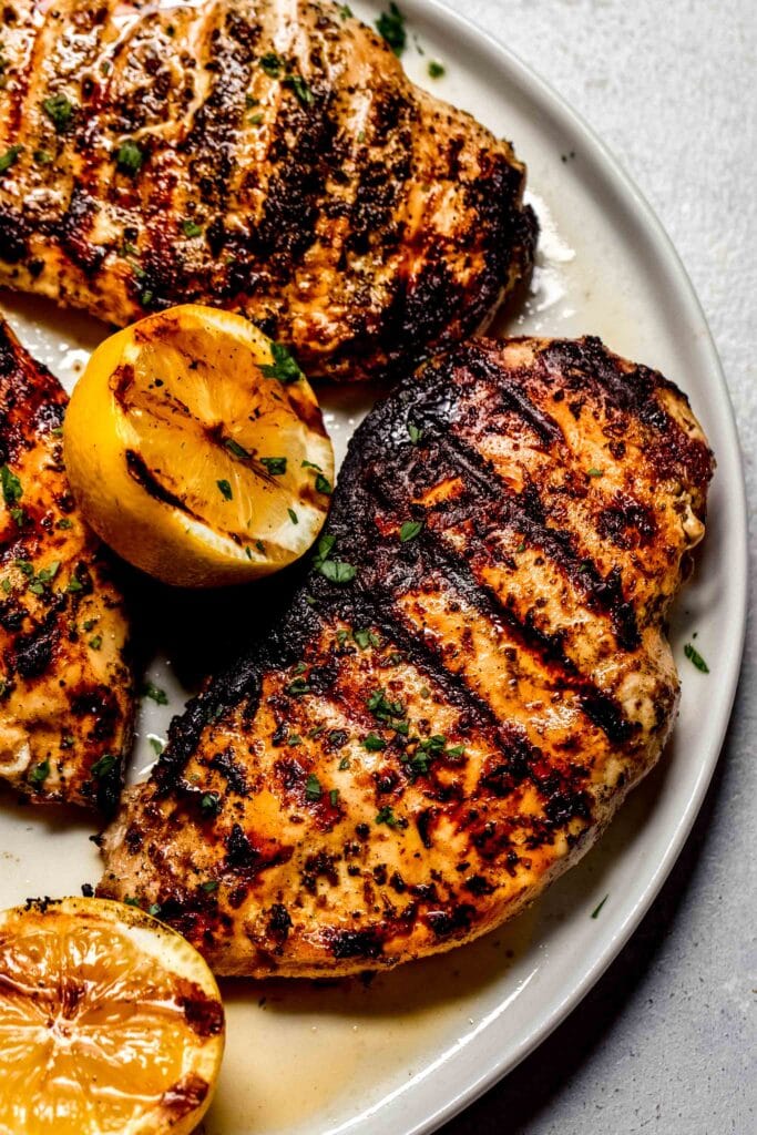 Smoked Chicken on plate with grill marks.