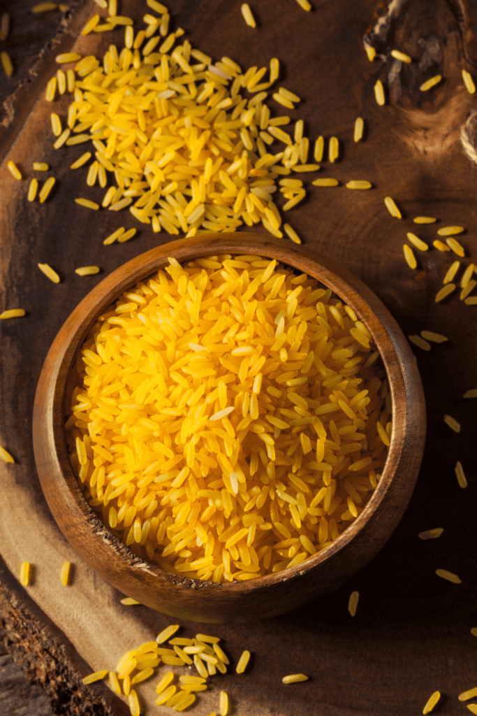 Yellow rice in wood bowl. 