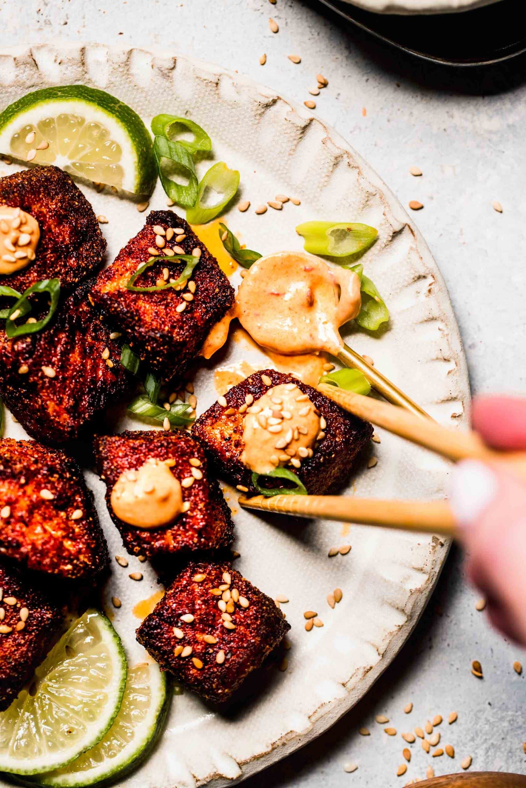 Air fryer salmon bites topped with chipotle crema.