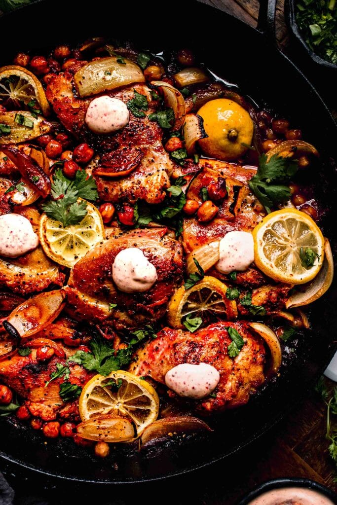 Prepared harissa chicken in skillet ready to be served. 