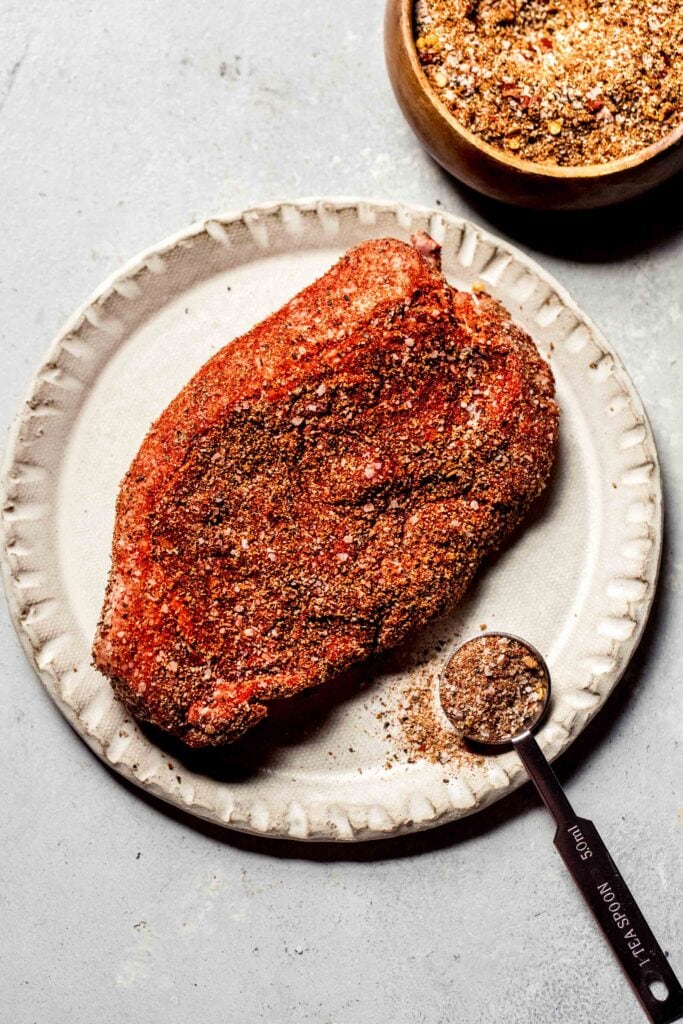 Steak sprinkled with dry rub. 