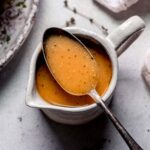 Turkey gravy in small cruet with spoon.