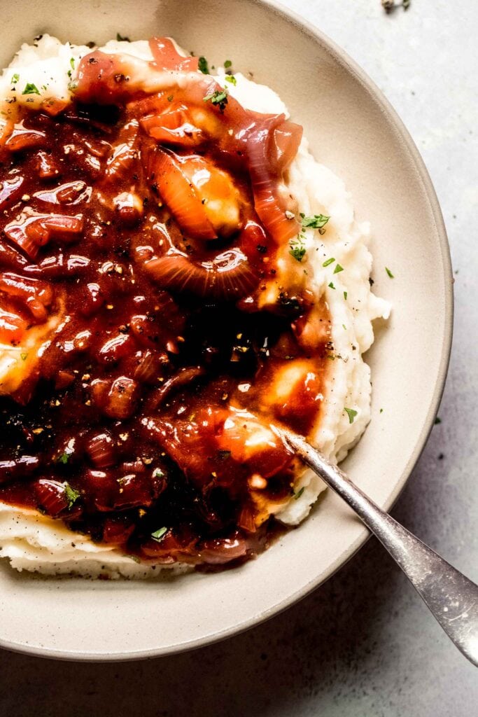 Finished onion gravy served over mashed potatoes. 