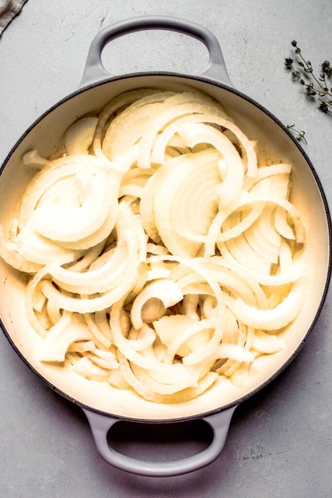 Raw onions in skillet. 