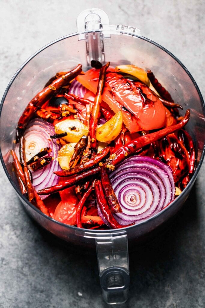 Ingredients for peri peri sauce in food processor bowl.