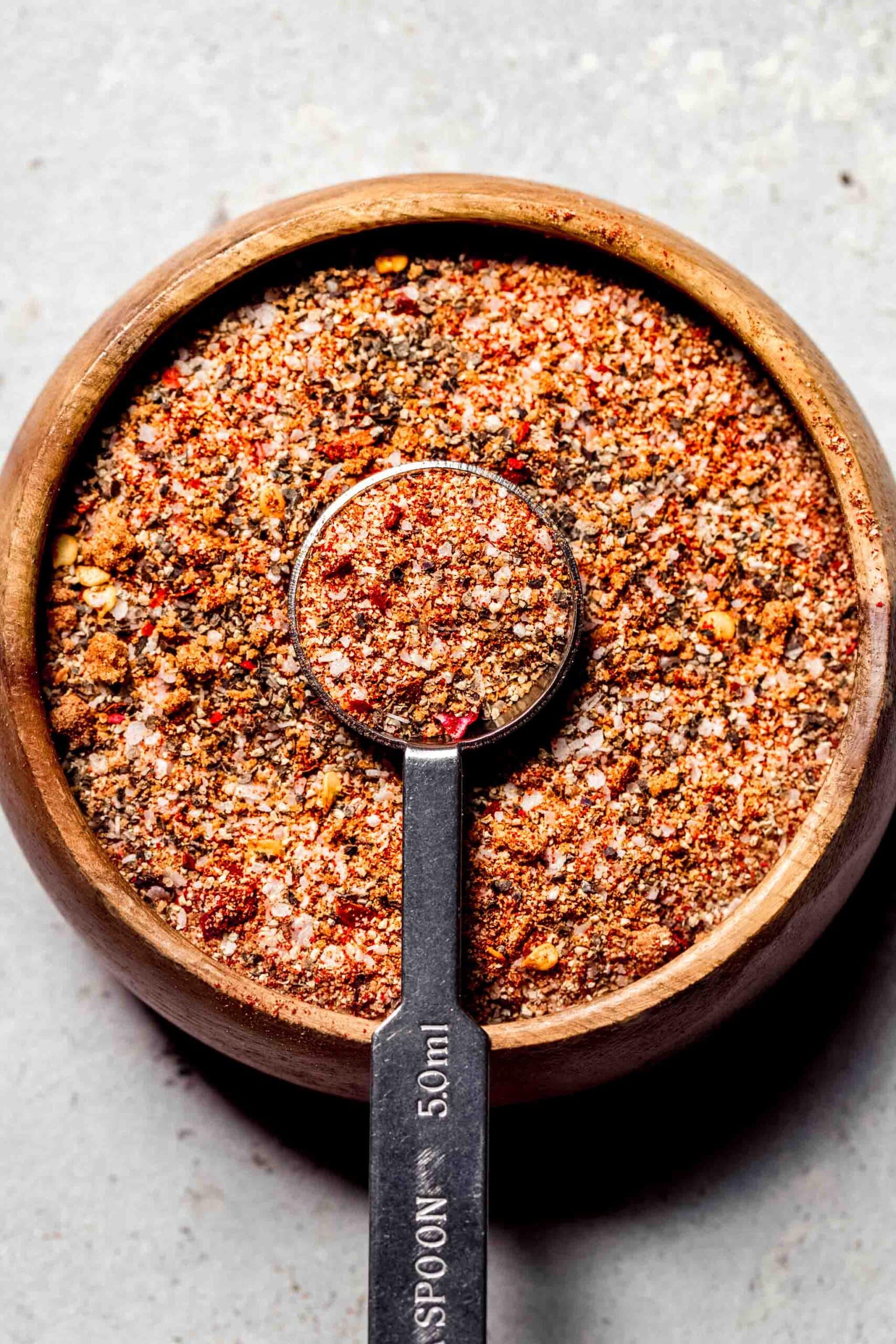 Steak seasoning in small wooden bowl.