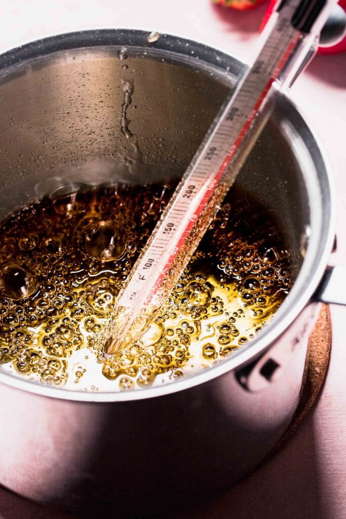 Boiling sugar mixture in small pot.