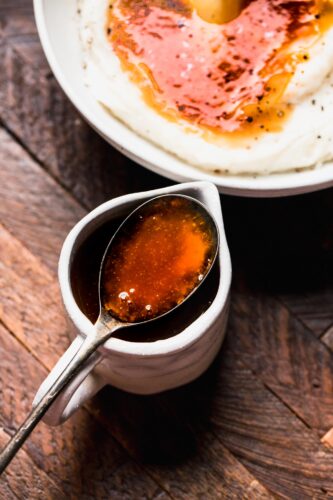 Beef gravy in small gravy boat.