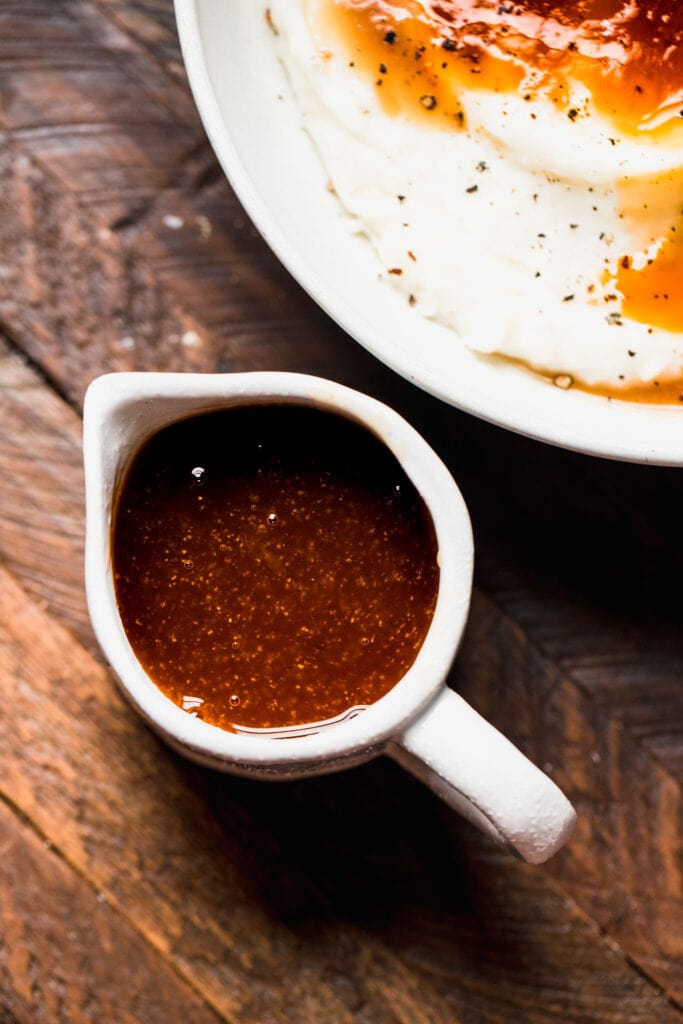 Beef gravy in small gravy boat.