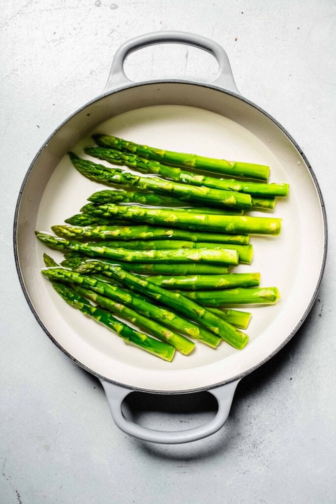 Asparagus in pot of water.