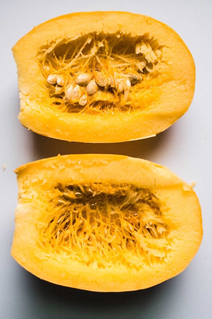 Halved spaghetti squash before removing seeds.