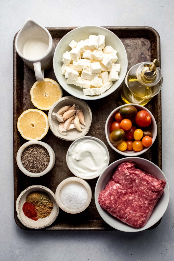 Ingredients for lamb whipped feta dip on counter.