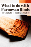 Parmesan rinds on counter with text overlay - ways to use parmesan rinds.