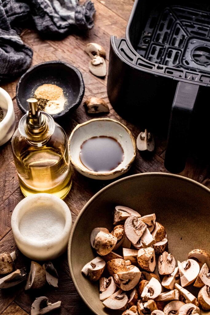 Ingredients for air fryer mushrooms on counter. 