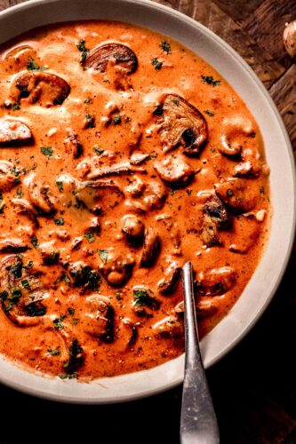 Jaeger sauce in bowl with spoon.