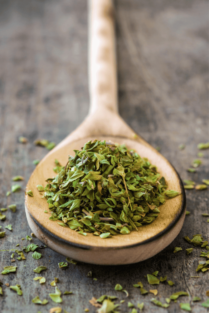 Dried spices on spoon.