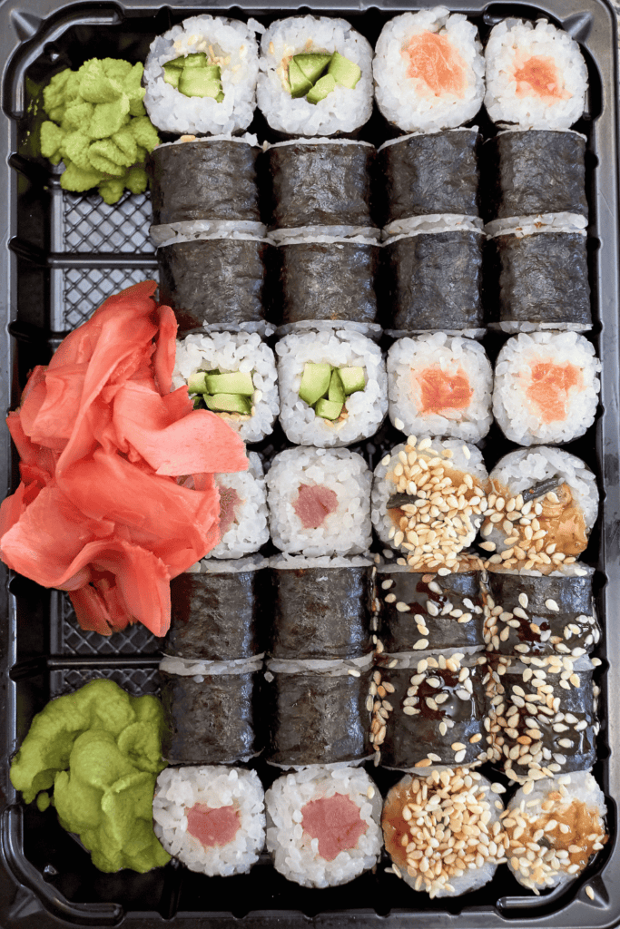 Maki sushi rolls on platter. 
