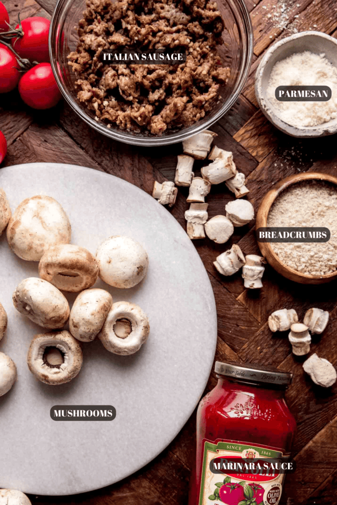 Ingredients for italian stuffed mushrooms labeled on counter.