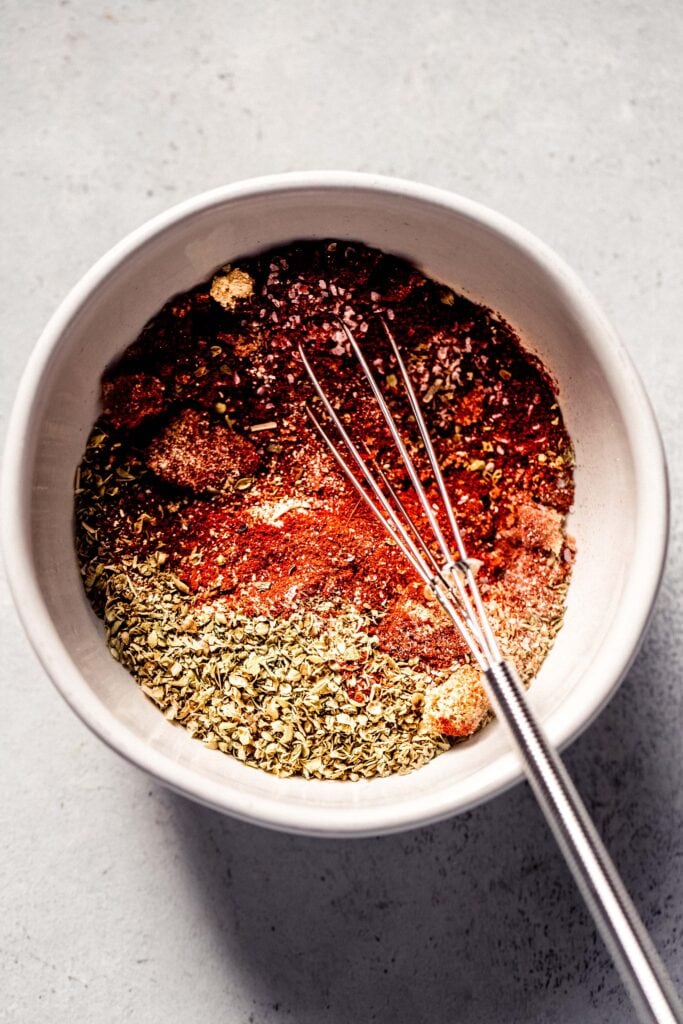 Dry rub ingredients being whisked.