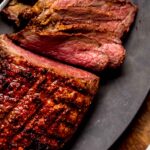 Sliced roast on serving platter.