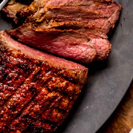 Sliced roast on serving platter.