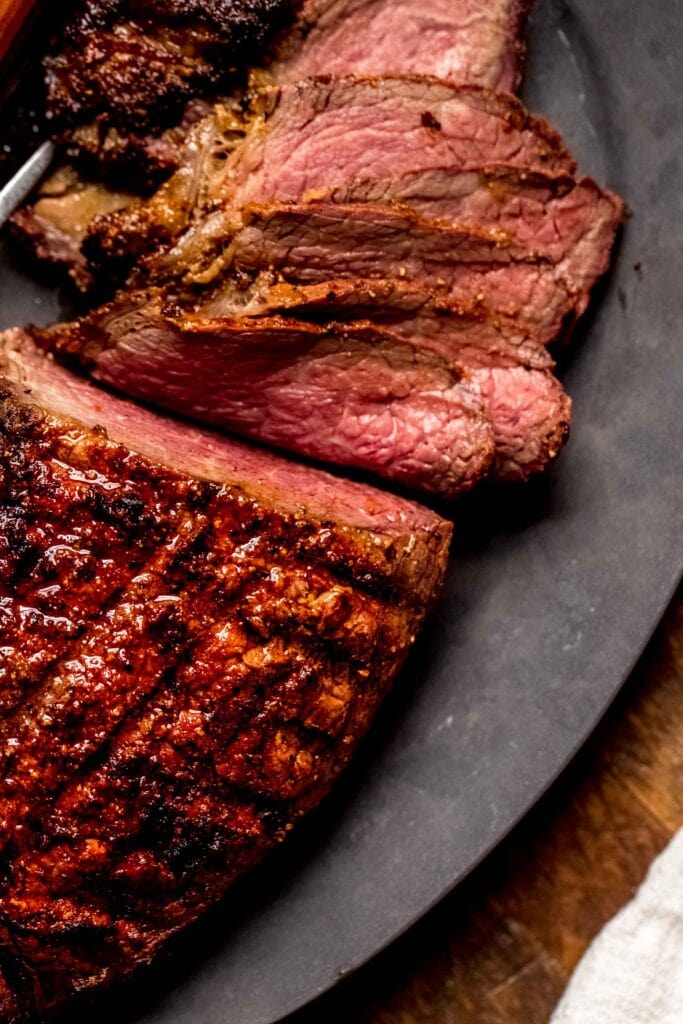 Sliced roast on serving platter.