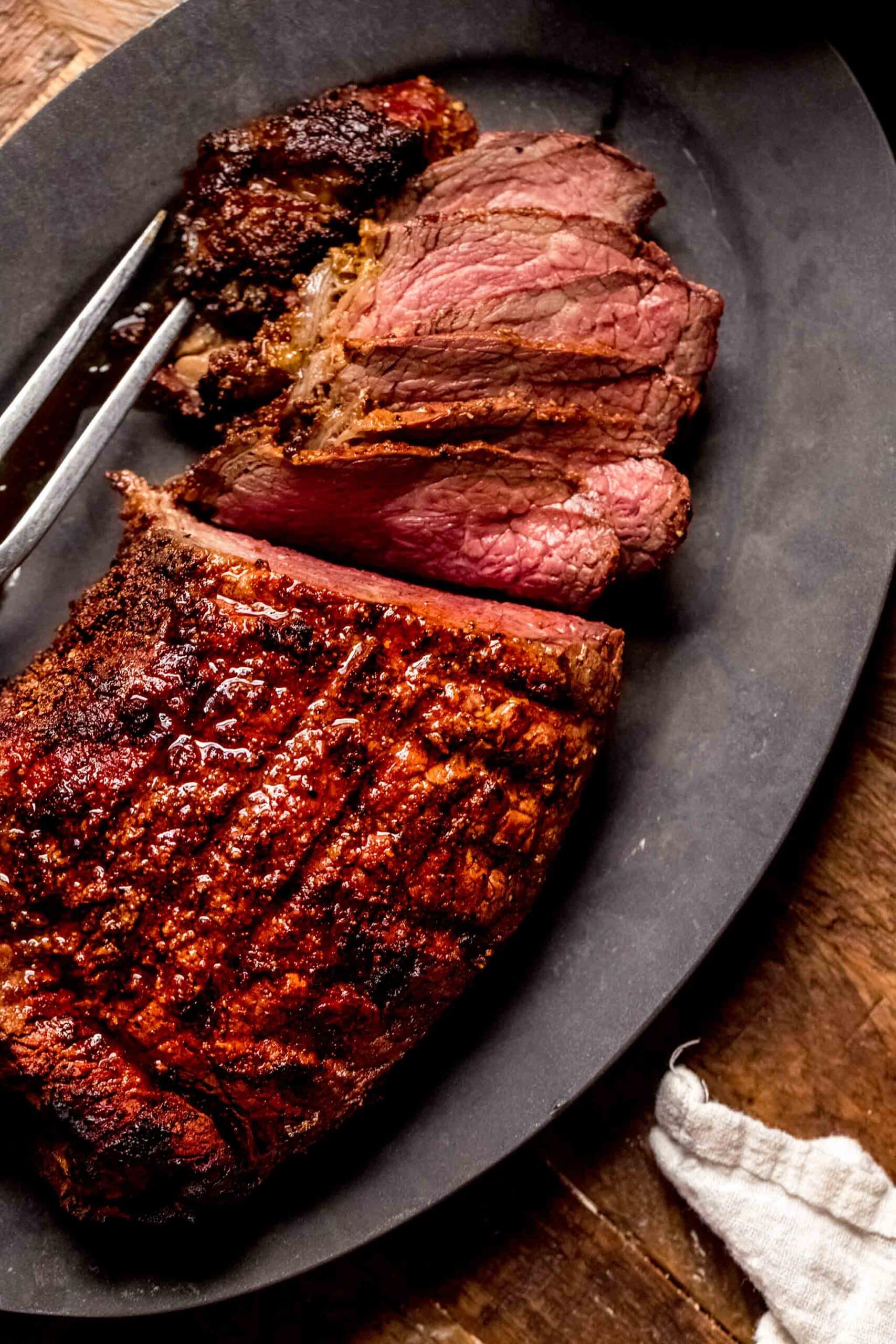 Sliced roast on serving platter.