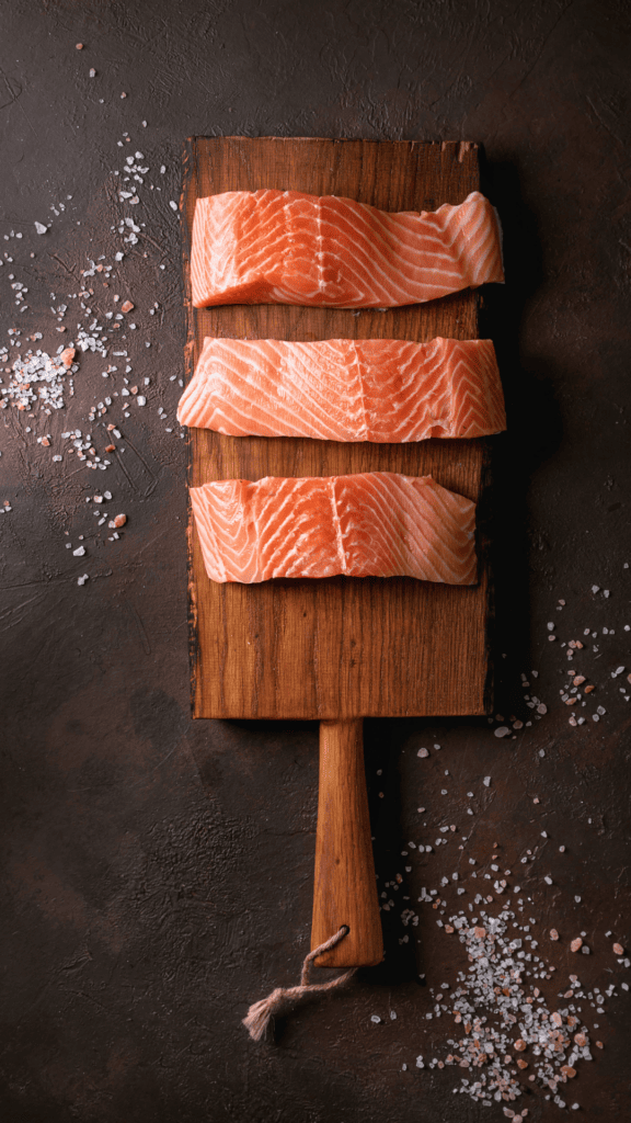 Salmon filets on cutting board.