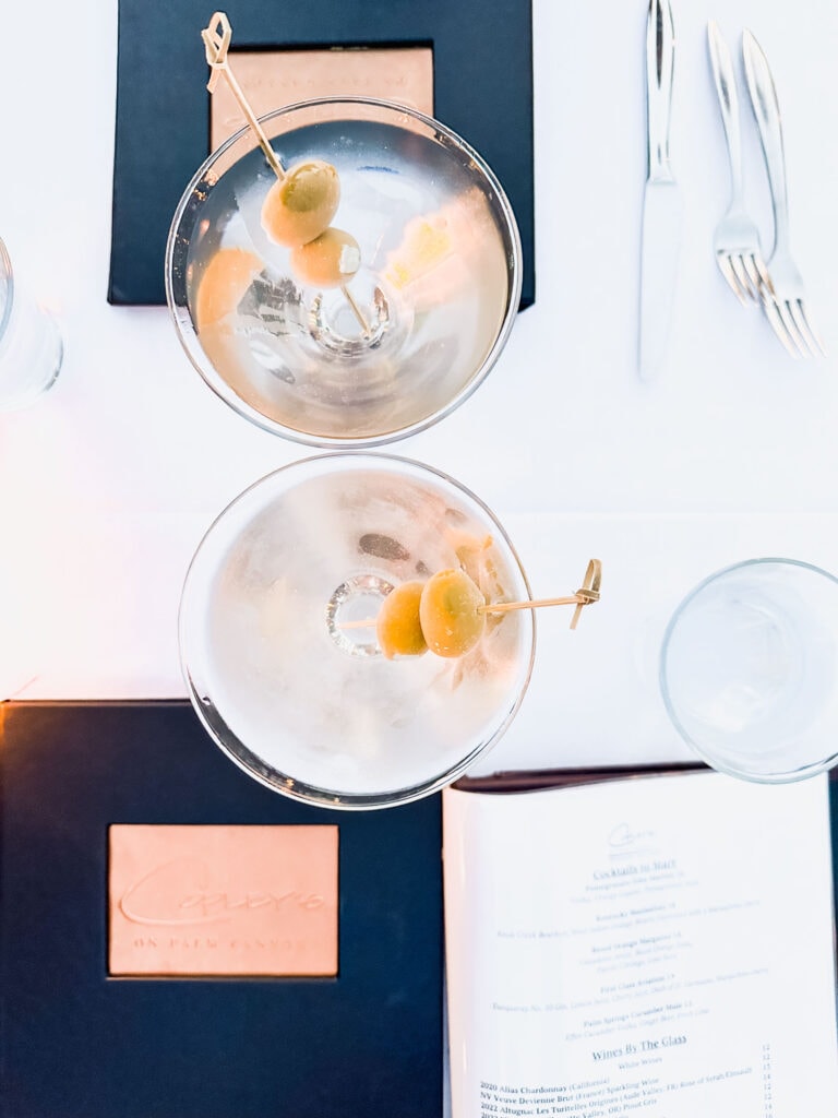 Two martinis on counter.