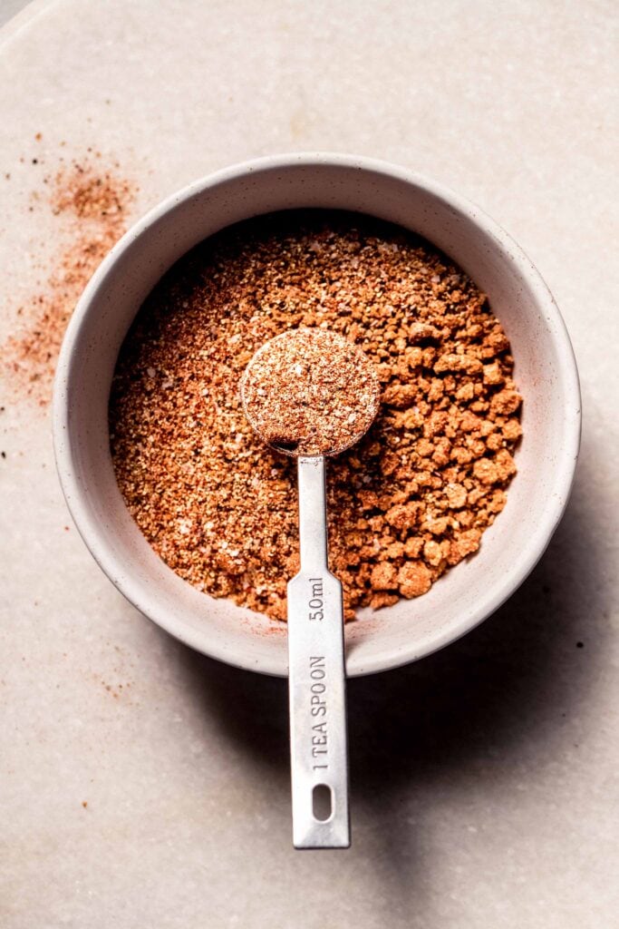 Dry rub for pork chops in small bowl.