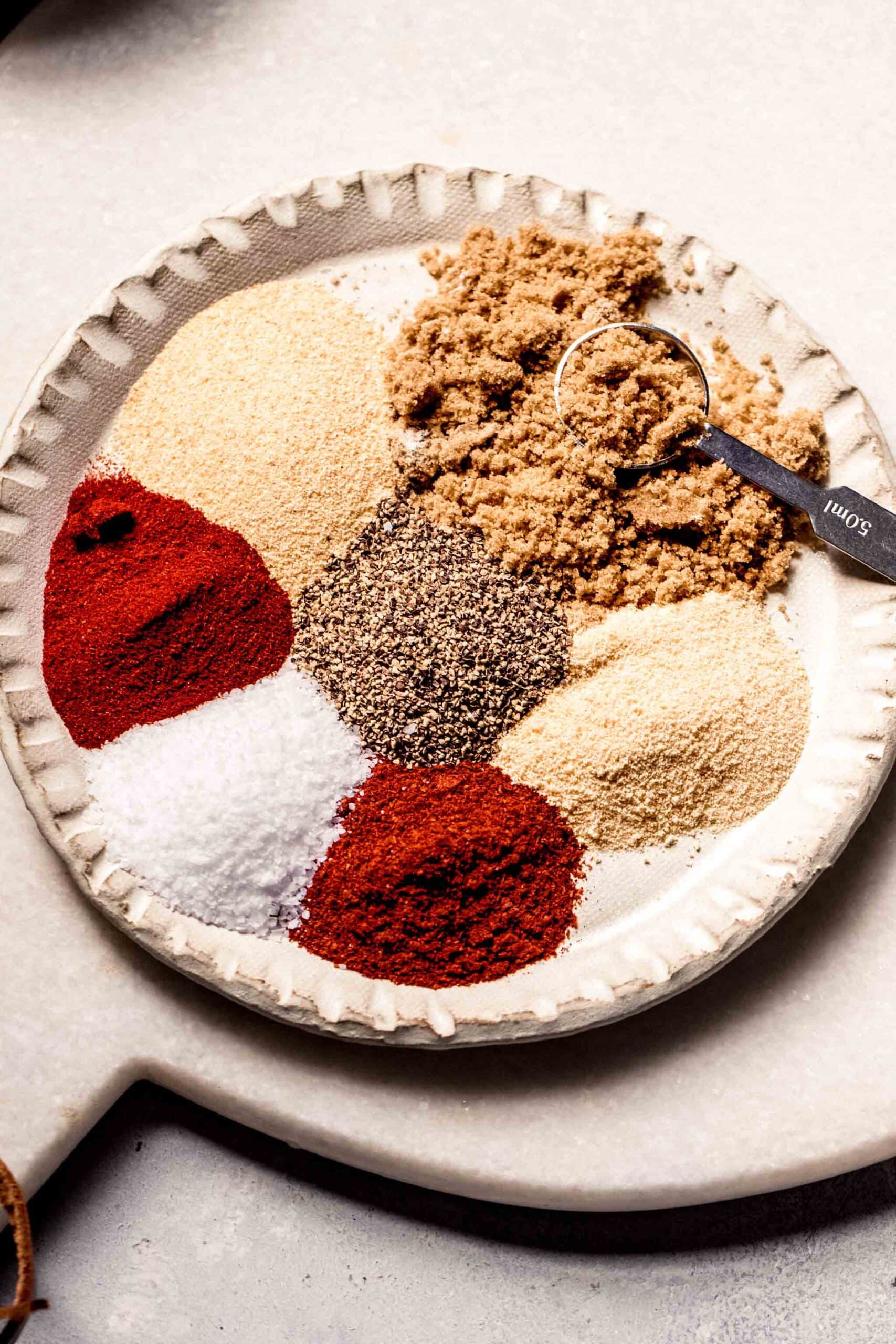 Spices for pork dry rub on plate.