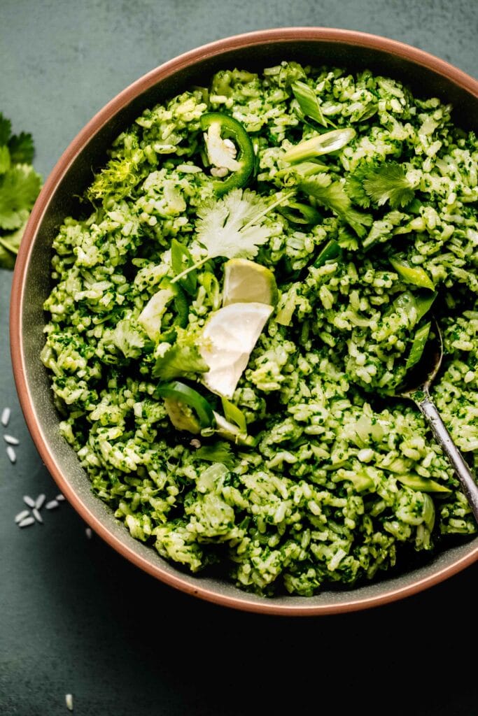 Green rice in serving bowl.