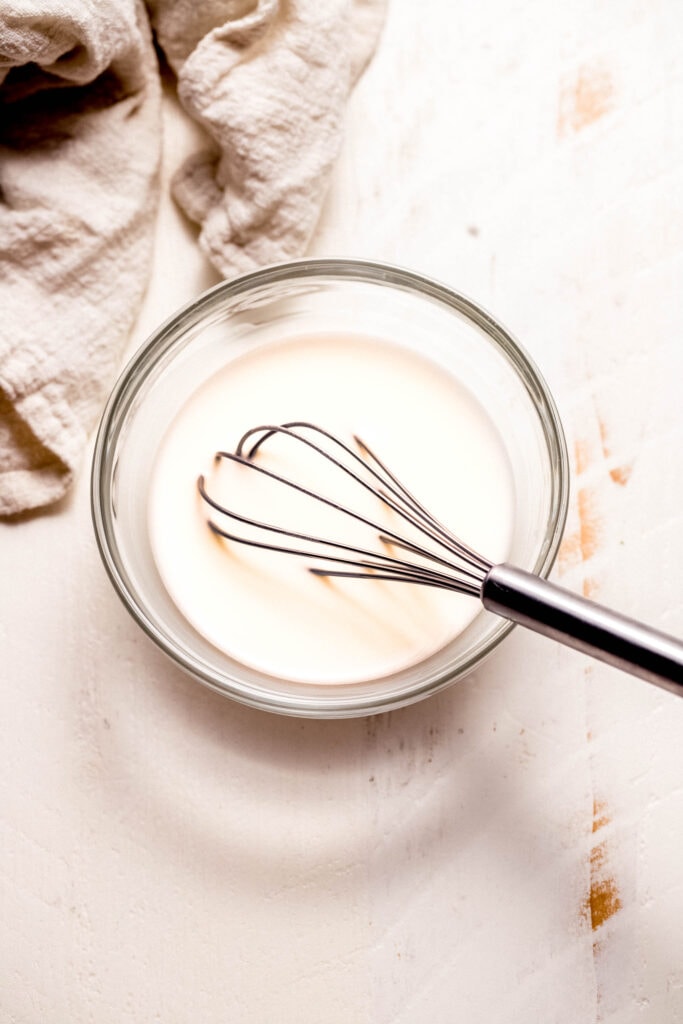 Cornstarch and water whisked together.