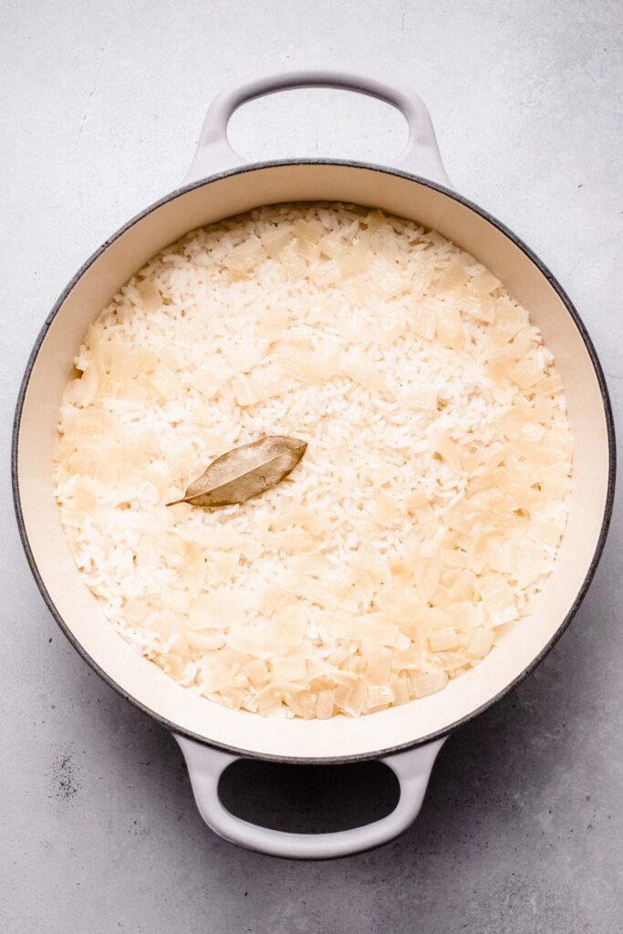 Cooked rice in skillet.