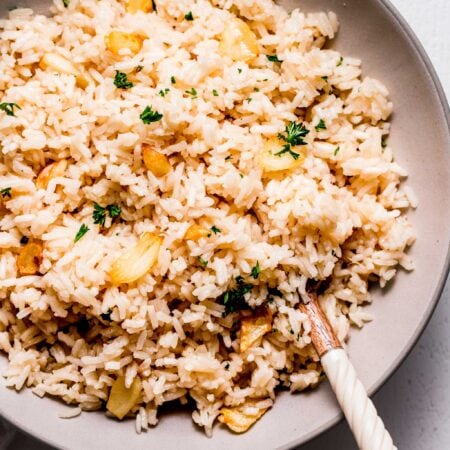 Close up of garlic rice in serving bowl.