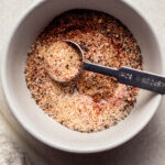 Chicken seasonings whisked together in small bowl.